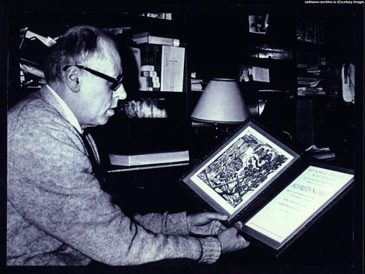 Andrei Sakharov studies his Nobel Prize diploma in his Moscow apartment in 1975. Source: Sakharov Archives. 