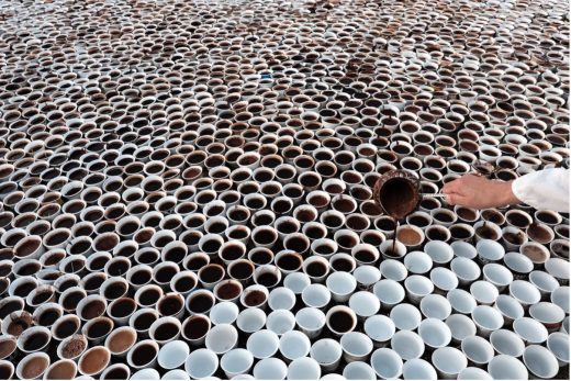 The art installation Što te nema [Why are you not here?]. A nomadic memorial by the artist, Aida Šehović, consisted of small porcelain coffee cups, filidžani, filled with Bosnian coffee. Photo: Paul Lowe ©Aida Šehović.