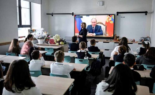 Pupils of a secondary school listen to Russia’s President Vladimir Putin’s address at the first day of the new school year in Moscow on September 1, 2025. This is a genre photo, the people in the image does not have anything to do with the persons mentioned in the article. PHOTO: ALEXANDER NEMENOV/GETTY IMAGES